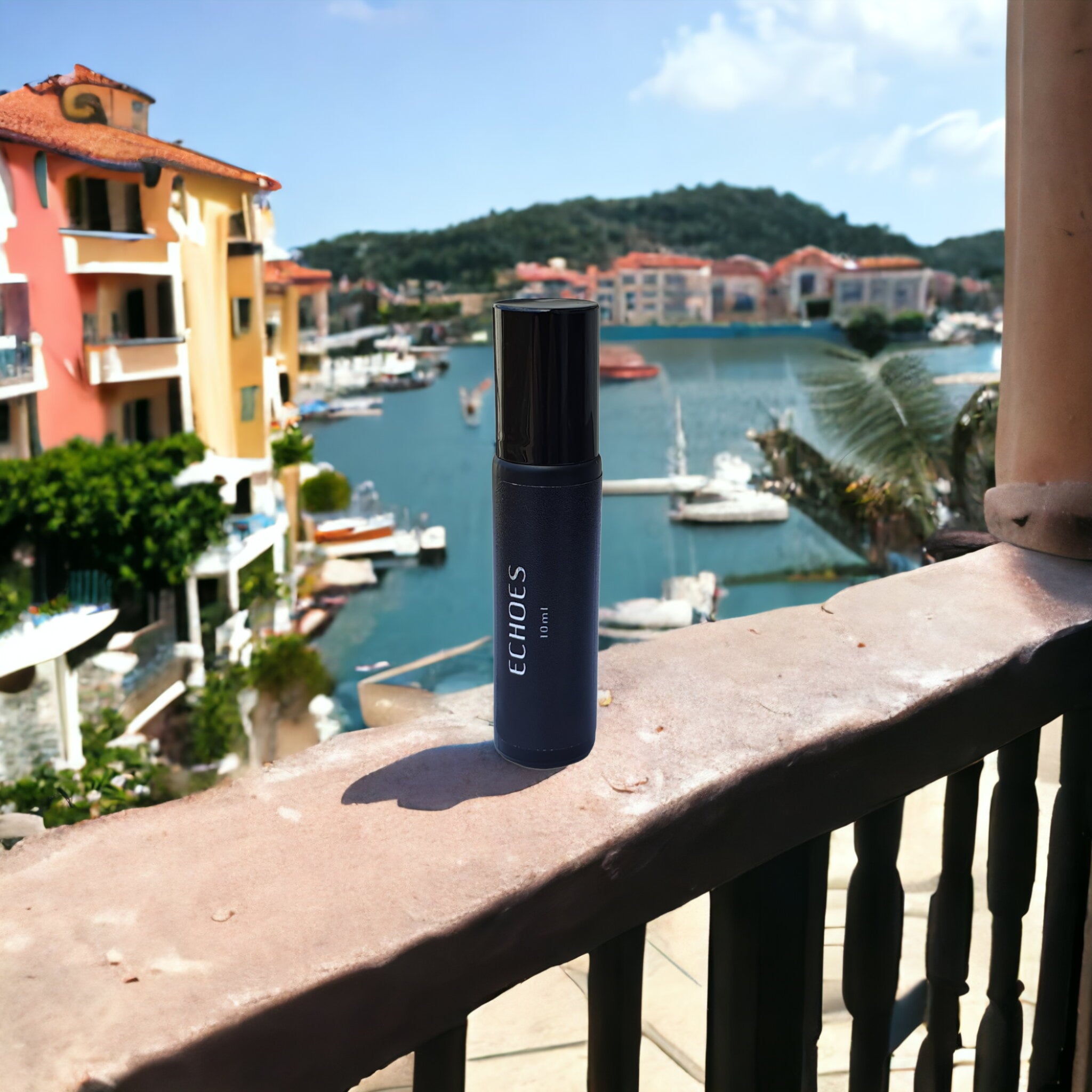 Bottle of Echoes of Neroli Portofino overlooking a harbour